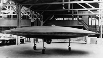 A 3/5 scale model of a proposed VTOL 'flying saucer' aircraft, the Couzinet Aerodyne RC-360, on display at a workshop on the Ile de la Jatte in Levallois-Perret, Paris, 1955. Designed by French aeronautical engineer Rene Couzinet (1904 - 1956), the Aerodyne was to feature two contra-rotating crowns of 96 small wings rotating around a motionless cockpit. These were to be powered by six 180 HP Lycoming engines in three pairs. Horizontal propulsion was to be provided by the jet engine, which can be seen mounted under the cockpit. The aircraft was refused government backing, however, and never reached the prototype stage. (Photo by Keystone/Hulton Archive/Getty Images)