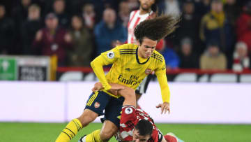SHEFFIELD, ENGLAND - OCTOBER 21: Matteo Guendouzi of Arsenal challenged by Enda Steven of Sheff United during the Premier League match between Sheffield United and Arsenal FC at Bramall Lane on October 21, 2019 in Sheffield, United Kingdom. (Photo by Stuart MacFarlane/Arsenal FC via Getty Images)