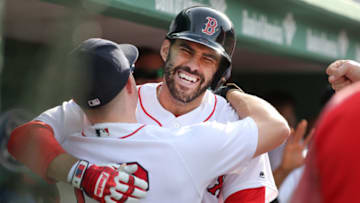 BOSTON - JUNE 9: Boston Red Sox player J.D Martinez celebrates in the dugout with teammate Brock Holt after hitting a two-run home run during the fifth inning. The Boston Red Sox host the Chicago White Sox in a regular season MLB baseball game at Fenway Park in Boston on June 9, 2018. (Photo by Matthew J. Lee/The Boston Globe via Getty Images)