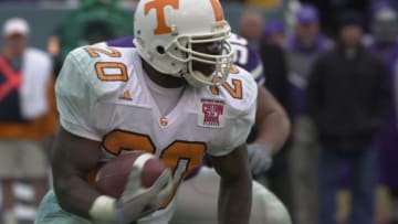 Tennessee 20-Travis Henry looks to beat a Kansas State player around the corner during first half action Monday in the Cotton Bowl. Kansas State beat Tennessee 35-21.Imaging Please View Print Version For Toning