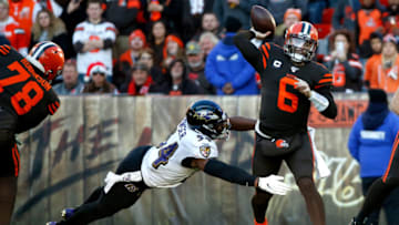 CLEVELAND, OH - DECEMBER 22: Baker Mayfield #6 of the Cleveland Browns throws the ball as he is hit by Tyus Bowser #54 of the Baltimore Ravens during the game at FirstEnergy Stadium on December 22, 2019 in Cleveland, Ohio. Baltimore defeated Cleveland 31-15. (Photo by Kirk Irwin/Getty Images)
