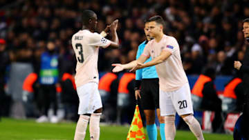 PARIS, FRANCE - MARCH 06: Diogo Dalot of Manchester United replaces teammate Eric Bailly as a substitute during the UEFA Champions League Round of 16 Second Leg match between Paris Saint-Germain and Manchester United at Parc des Princes on March 06, 2019 in Paris, France. (Photo by Chris Brunskill/Fantasista/Getty Images)