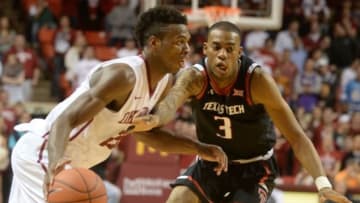 Jan 26, 2016; Norman, OK, USA; Oklahoma Sooners guard Buddy Hield (24) drives to the basket in front of Texas Tech Red Raiders guard C.J. Williamson (3) during the second half at Lloyd Noble Center. Mandatory Credit: Mark D. Smith-USA TODAY Sports