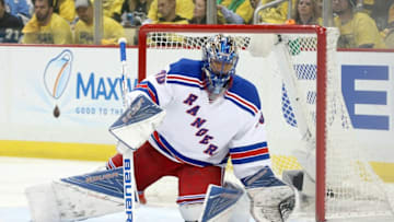Apr 23, 2016; Pittsburgh, PA, USA; New York Rangers goalie Henrik Lundqvist (30) sweeps the puck from in front of the net against the Pittsburgh Penguins during the first period in game five of the first round of the 2016 Stanley Cup Playoffs at the CONSOL Energy Center. Mandatory Credit: Charles LeClaire-USA TODAY Sports