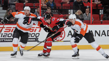 OTTAWA, ON - NOVEMBER 15: Bobby Ryan #9 of the Ottawa Senators pushes back against Ivan Provorov #9 and Tyler Pitlick #18 of the Philadelphia Flyers at Canadian Tire Centre on November 15, 2019 in Ottawa, Ontario, Canada. (Photo by Andre Ringuette/NHLI via Getty Images)