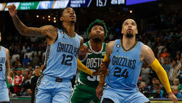 Nov 7, 2022; Memphis, Tennessee, USA; Memphis Grizzlies guard Ja Morant (12) and forward Dillon Brooks (24) box out Boston Celtics guard Marcus Smart (middle) during the second half at FedExForum. Mandatory Credit: Petre Thomas-USA TODAY Sports