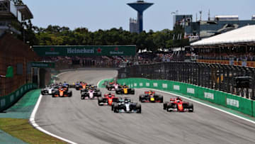 SAO PAULO, BRAZIL - NOVEMBER 12: Sebastian Vettel of Germany driving the (5) Scuderia Ferrari SF70H and Valtteri Bottas driving the (77) Mercedes AMG Petronas F1 Team Mercedes F1 WO8 lead the field toward turn one at the start during the Formula One Grand Prix of Brazil at Autodromo Jose Carlos Pace on November 12, 2017 in Sao Paulo, Brazil. (Photo by Mark Thompson/Getty Images)