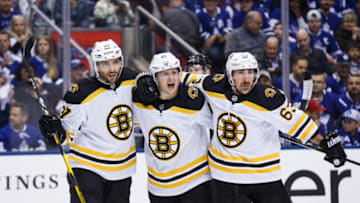 TORONTO, ON - APRIL 21: Torey Krug #47 of the Boston Bruins celebrates his goal against the Toronto Maple Leafs with teammates Patrice Bergeron #37 and Brad Marchand during the first period during Game Six of the Eastern Conference First Round during the 2019 NHL Stanley Cup Playoffs at the Scotiabank Arena on April 21, 2019 in Toronto, Ontario, Canada. (Photo by Kevin Sousa/NHLI via Getty Images)