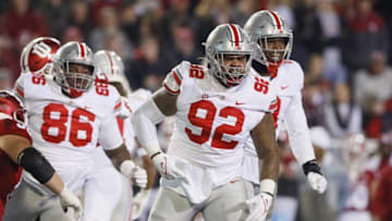 Ohio State Buckeyes defensive tackle Haskell Garrett (92) and defensive end Javontae Jean-Baptiste (8) celebrate a sack during the NCAA football game against the Indiana Hoosiers at Memorial Stadium in Bloomington, Ind. on Sunday, Oct. 24, 2021. Ohio State won 54-7.Ohio State Buckeyes At Indiana Hoosiers
