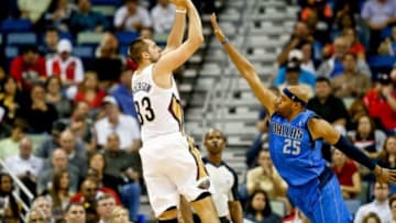 Dec 4, 2013; New Orleans, LA, USA; New Orleans Pelicans power forward Ryan Anderson (33) shoots over Dallas Mavericks shooting guard Vince Carter (25) during the second half of a game at New Orleans Arena.The Mavericks defeated the Pelicans 100-97. Mandatory Credit: Derick E. Hingle-USA TODAY Sports