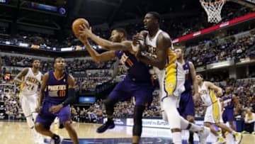 Jan 30, 2014; Indianapolis, IN, USA; Indiana Pacers center Roy Hibbert (55) battles for a rebound against Phoenix Suns forward Markieff Morris (11) at Bankers Life Fieldhouse. Phoenix defeats Indiana 102-94. Mandatory Credit: Brian Spurlock-USA TODAY Sports
