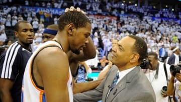 May 15, 2013; Oklahoma City, OK, USA; Memphis Grizzlies head coach Lionel Hollins (right) congratulates Oklahoma City Thunder small forward Kevin Durant (35) after game five of the second round of the 2013 NBA Playoffs at Chesapeake Energy Arena. The Grizzlies defeated the Thunder 88-84. Mandatory Credit: Jerome Miron-USA TODAY Sports