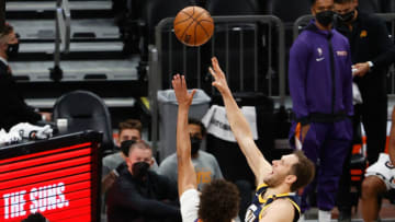 PHOENIX, ARIZONA - APRIL 30: Bojan Bogdanovic #44 of the Utah Jazz attempts a shot over Cameron Johnson #23 of the Phoenix Suns during the first half of the NBA game at Phoenix Suns Arena on April 30, 2021 in Phoenix, Arizona. NOTE TO USER: User expressly acknowledges and agrees that, by downloading and or using this photograph, User is consenting to the terms and conditions of the Getty Images License Agreement. (Photo by Christian Petersen/Getty Images)