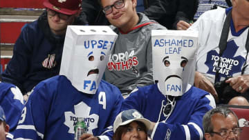 SUNRISE, FL - APRIL 10: Two Toronto Maple Leafs fans wearing paper bags over their heads watch third period action against the Florida Panthers at the BB