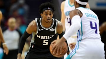 CHARLOTTE, NORTH CAROLINA - DECEMBER 17: De'Aaron Fox #5 of the Sacramento Kings guards Devonte' Graham #4 of the Charlotte Hornets during the first quarter at the Spectrum Center on December 17, 2019 in Charlotte, North Carolina. NOTE TO USER: User expressly acknowledges and agrees that, by downloading and/or using this photograph, user is consenting to the terms and conditions of the Getty Images License Agreement. (Photo by Jacob Kupferman/Getty Images)