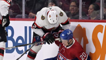 Oct 4, 2022; Montreal, Quebec, CAN; Ottawa Senators defenseman Artem Zub (2) pushes Montreal Canadiens forward Juraj Slafkovsky (20) during the first period at the Bell Centre. Mandatory Credit: Eric Bolte-USA TODAY Sports