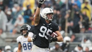 Sep 12, 2015; University Park, PA, USA; Penn State Nittany Lions defensive end Carl Nassib (95) reacts after intercepting the ball during the second quarter against the Buffalo Bulls at Beaver Stadium. Mandatory Credit: Matthew O