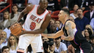 Feb 7, 2016; Miami, FL, USA; Miami Heat forward Luol Deng (9) is pressured by Los Angeles Clippers guard J.J. Redick (4) during the first half at American Airlines Arena. Mandatory Credit: Steve Mitchell-USA TODAY Sports
