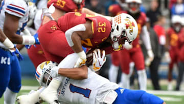 LAWRENCE, KS - NOVERMBER 3: Running back David Montgomery #32 of the Iowa State Cyclones is tackled by safety Bryce Torneden #1 of the Kansas Jayhawks in the first quarter at Memorial Stadium on November 3, 2018 in Lawrence, Kansas. (Photo by Ed Zurga/Getty Images)