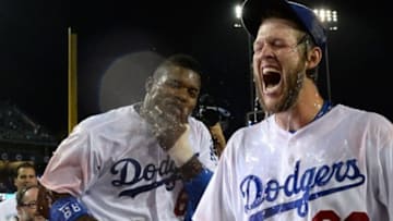 Los Angeles Dodgers starting pitcher Clayton Kershaw (22) and right fielder Yasiel Puig (66) react after a Powerade shower to celebrate the no hitter against the Colorado Rockies at Dodger Stadium. Dodgers won 8-0.Mandatory Credit: Jayne Kamin-Oncea-USA TODAY Sports