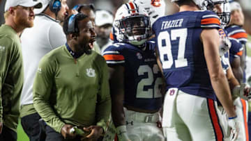 Auburn football interim head coach Carnell "Cadillac" Williams talks with his team during a break in the action as Auburn Tigers take on Texas A&M Aggies at Jordan-Hare Stadium in Auburn, Ala., on Saturday, Nov. 12, 2022. Auburn Tigers lead Texas A&M 7-0 at halftime.