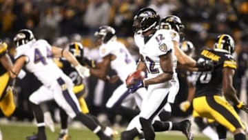 Nov 2, 2014; Pittsburgh, PA, USA; Baltimore Ravens wide receiver Jacoby Jones (12) returns a kick-off for a one hundred and eight yard touchdown return against the Pittsburgh Steelers during the fourth quarter at Heinz Field. The Steelers won 43-23. Mandatory Credit: Charles LeClaire-USA TODAY Sports