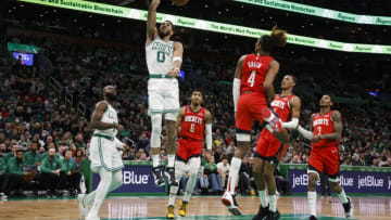 Jayson Tatum's playing time leans a bit on the heavy side -- reducing his playing time could actually help the Boston Celtics (Photo By Winslow Townson/Getty Images)