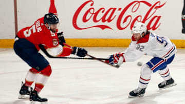 SUNRISE, FL - FEBRUARY 17: Jonathan Drouin #92 of the Montreal Canadiens crosses sticks with Aaron Ekblad #5 of the Florida Panthers at the BB&T Center on February 17, 2019 in Sunrise, Florida. (Photo by Eliot J. Schechter/NHLI via Getty Images)