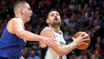DENVER, CO - NOVEMBER 23: Nikola Vucevic #9 of the Orlando Magic drives to the basket against Nikola Jokic #15 of the Denver Nuggets at the Pepsi Center on November 23, 2018 in Denver, Colorado. (Photo by Matthew Stockman/Getty Images) NOTE TO USER: User expressly acknowledges and agrees that, by downloading and or using this photograph, User is consenting to the terms and conditions of the Getty Images License Agreement.