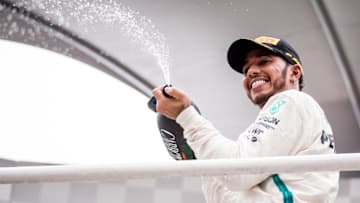 SAO PAULO, BRAZIL - NOVEMBER 11: Race winner Lewis Hamilton of Great Britain and Mercedes GP celebrates on the podium during the Formula One Grand Prix of Brazil at Autodromo Jose Carlos Pace on November 11, 2018 in Sao Paulo, Brazil. (Photo by Lars Baron/Getty Images)