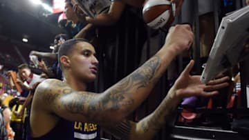 LAS VEGAS, NV - JULY 16: Kyle Kuzma #0 of the Los Angeles Lakers signs autographs for fans after the team's 108-98 win over the Dallas Mavericks in a semifinal game of the 2017 Summer League at the Thomas & Mack Center on July 16, 2017 in Las Vegas, Nevada. NOTE TO USER: User expressly acknowledges and agrees that, by downloading and or using this photograph, User is consenting to the terms and conditions of the Getty Images License Agreement. (Photo by Ethan Miller/Getty Images)