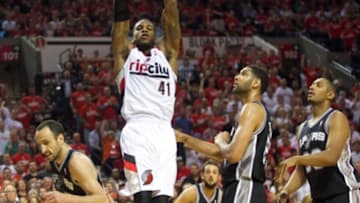 May 12, 2014; Portland, OR, USA; Portland Trail Blazers forward Thomas Robinson (41) dunks over the San Antonio Spurs in the second half of game four of the second round of the 2014 NBA Playoffs at the Moda Center. Mandatory Credit: Jaime Valdez-USA TODAY Sports