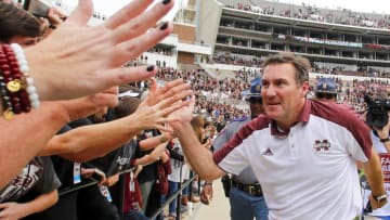 STARKVILLE, MS - NOVEMBER 5: Head coach Dan Mullen of the Mississippi State Bulldogs celebrates with fans after the end of an NCAA college football game at Davis Wade Stadium on November 5, 2016 in Starkville, Mississippi. Mississippi State beat the Texas A