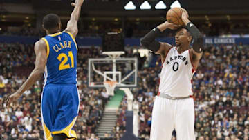 Oct 1, 2016; Vancouver, British Columbia, CAN; Toronto Raptors forward Jared Sullinger (0) lines up to shoot as Golden State Warriors Guard Ian Clark (21) defends in the third quarter at Rogers Arena. Mandatory Credit: Peter Llewellyn-USA TODAY Sports