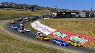 SONOMA, CALIFORNIA - JUNE 23: Kyle Larson, driver of the #42 Credit One Bank Chevrolet, and William Byron, driver of the #24 Hertz Chevrolet, lead the field through "The Carousel" during the Monster Energy NASCAR Cup Series Toyota/Save Mart 350 at Sonoma Raceway on June 23, 2019 in Sonoma, California. (Photo by Jared C. Tilton/Getty Images)
