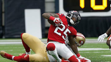 HOUSTON, TX - DECEMBER 10: Kareem Jackson #25 of the Houston Texans intercepts the ball and is horse-collar tackled by Garrett Celek #88 of the San Francisco 49ers in the first quarter at NRG Stadium on December 10, 2017 in Houston, Texas. (Photo by Bob Levey/Getty Images)
