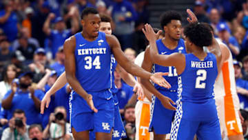 Mar 12, 2022; Tampa, FL, USA; Kentucky Wildcats forward Oscar Tshiebwe (34), Kentucky Wildcats guard Sahvir Wheeler (2) and teammates celebrate against the Tennessee Volunteers during the second half at Amalie Arena. Mandatory Credit: Kim Klement-USA TODAY Sports