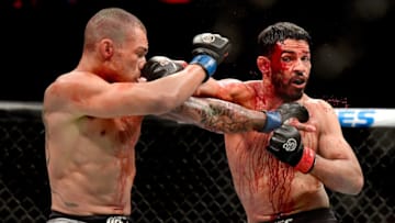 NEW YORK, NY - NOVEMBER 03: Sheymon Moraes of Brazil (L) fights against Julio Arce of the United States in their featherweight bout during the UFC 230 event at Madison Square Garden on November 3, 2018 in New York City. (Photo by Steven Ryan/Getty Images)