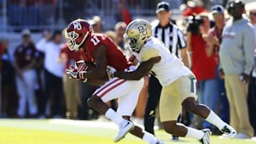 Nov 12, 2016; Norman, OK, USA; Oklahoma Sooners wide receiver Dede Westbrook (11) makes a catch against Baylor Bears cornerback Ryan Reid (9) during the second quarter at Gaylord Family - Oklahoma Memorial Stadium. Mandatory Credit: Kevin Jairaj-USA TODAY Sports