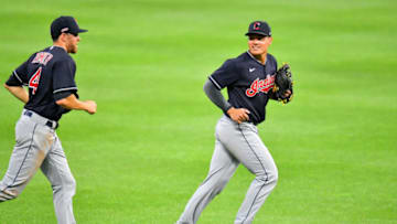 CLEVELAND, OHIO - JULY 15: Bradley Zimmer #4 talks with Yu Chang #2 of the Cleveland Indians as they run in from the outfield after the sixth inning of an intrasquad game at Progressive Field on July 15, 2020 in Cleveland, Ohio. (Photo by Jason Miller/Getty Images)