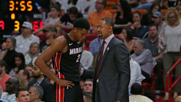 Miami Heat center Hassan Whiteside talks with assistant coach Juwan Howard during the third quarter against the Brooklyn Nets at the AmericanAirlines Arena in Miami on Saturday, March 31, 2018. (David Santiago/El Nuevo Herald/TNS via Getty Images)