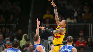 Dec 5, 2021; Atlanta, Georgia, USA; Atlanta Hawks forward John Collins (20) shoots against the Charlotte Hornets in the second quarter at State Farm Arena. Mandatory Credit: Brett Davis-USA TODAY Sports