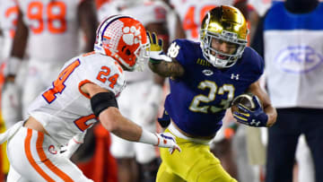 SOUTH BEND, INDIANA - NOVEMBER 07: Running back Kyren Williams #23 of the Notre Dame Fighting Irish stiff arms safety Nolan Turner #24 of the Clemson Tigers on his way to a touchdown in the first quarter at Notre Dame Stadium on November 7, 2020 in South Bend, Indiana. (Photo by Matt Cashore-Pool/Getty Images)