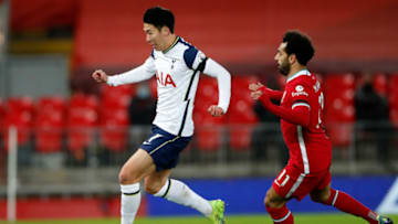 Liverpool's Egyptian midfielder Mohamed Salah (R) vies with Tottenham Hotspur's South Korean striker Son Heung-Min during the English Premier League football match between Liverpool and Tottenham Hotspur at Anfield in Liverpool, north west England on December 16, 2020. (Photo by Clive Brunskill / POOL / AFP) / RESTRICTED TO EDITORIAL USE. No use with unauthorized audio, video, data, fixture lists, club/league logos or 'live' services. Online in-match use limited to 120 images. An additional 40 images may be used in extra time. No video emulation. Social media in-match use limited to 120 images. An additional 40 images may be used in extra time. No use in betting publications, games or single club/league/player publications. / (Photo by CLIVE BRUNSKILL/POOL/AFP via Getty Images)
