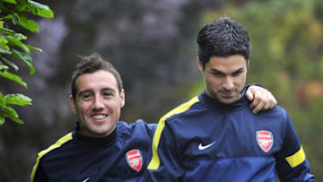 Arsenal's Spanish midfielder Santi Cazorla (L) and Spanish midfielder Mikel Arteta (R) attend training for the forthcoming UEFA Champions League group B football match against FC Schalke 04 at Arsenal's training ground, London Colney, North London, England on October 23, 2012. AFP PHOTO/GLYN KIRK (Photo credit should read GLYN KIRK/AFP via Getty Images)