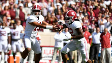 COLLEGE STATION, TEXAS - OCTOBER 12: Quarterback Tua Tagovailoa #13 of the Alabama Crimson Tide hands off to running back Najee Harris #22 during the game against Texas A&M Aggies at Kyle Field on October 12, 2019 in College Station, Texas. (Photo by Logan Riely/Getty Images)