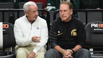 PORTLAND, OR - NOVEMBER 26: North Carolina Tar Heels head coach Roy Williams and Michigan State Spartans head coach Tom Izzo speak before the game between the Michigan State Spartans and the North Carolina Tar Heels during the PK80-Phil Knight Invitational presented by State Farm at the Moda Center on November 26, 2017 in Portland, Oregon. Photo by Steve Dykes/Getty Images)