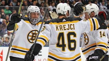 TORONTO, ON - JANUARY 12: Sean Kuraly #52 of the Boston Bruins celebrates a goal by teammate David Krejci #46 against the Toronto Maple Leafs during an NHL game at Scotiabank Arena on January 12, 2019 in Toronto, Ontario, Canada. The Bruins defeated the Maple Leafs 3-2. (Photo by Claus Andersen/Getty Images)