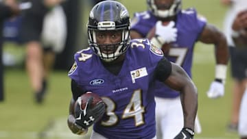 Jul 30, 2015; Owings Mills, MD, USA; Baltimore Ravens running back Lorenzo Taliaferro (34) carries the ball during drills on day one of training camp at Under Armour Performance Center. Mandatory Credit: Tommy Gilligan-USA TODAY Sports