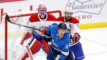 Mar 17, 2021; Winnipeg, Manitoba, CAN; Montreal Canadiens defenseman Shea Weber (6) checks Winnipeg Jets left wing Nikolaj Ehlers (27) in front of goaltender Carey Price (31) in the first period at Bell MTS Place. Mandatory Credit: James Carey Lauder-USA TODAY Sports